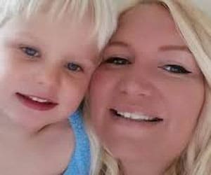 A woman and a young child with blonde hair are smiling close together for a selfie, capturing a joyful moment with Party Plan Guru Paula Giles.