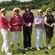 A group of women posing for a picture on a golf course, demonstrating their successful career as women returners in various jobs.