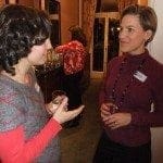 Dec2011JanFeb2012 185 Two working women discussing their work-life balance at an event.