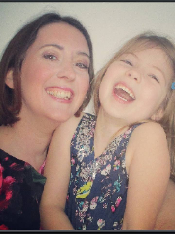 A career-oriented woman and her adorable little girl sharing laughter together.
