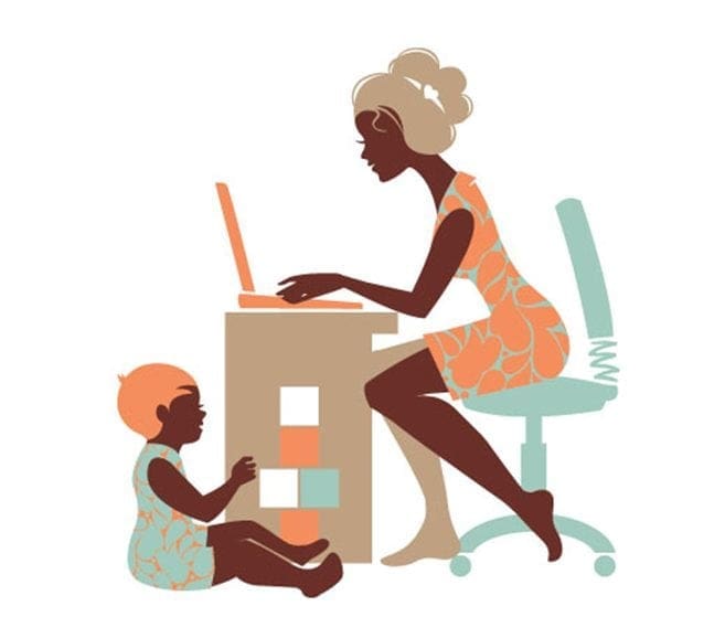 A working mom at a desk with her child and laptop.