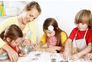 A group of women returners, including a mum, are making cookies in a kitchen while aiming to maintain work-life balance.