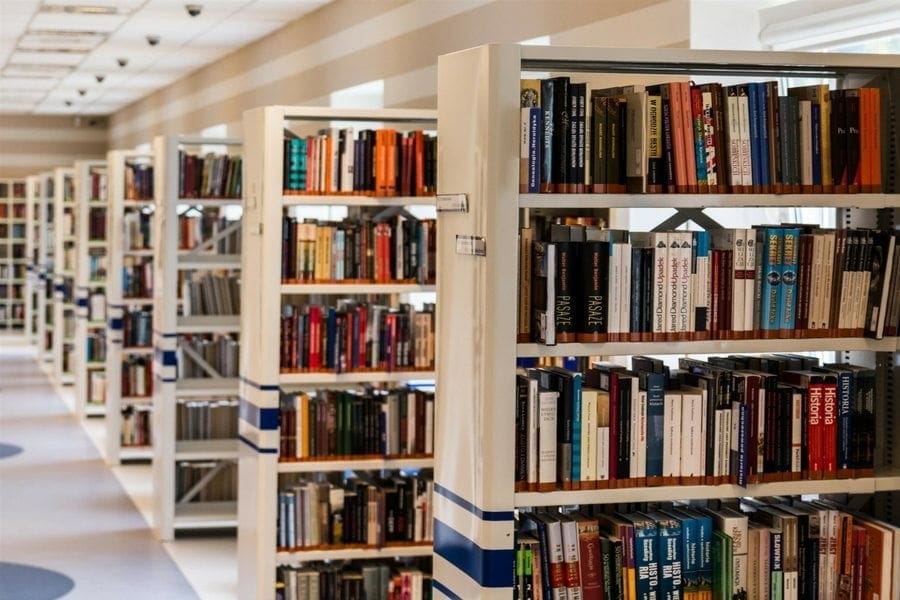 A row of bookshelves in a library providing ample storage for books and resources.