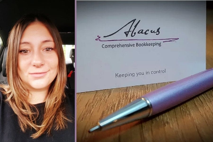         A woman with a purple pen next to a business card, targeting women returners in search of jobs.