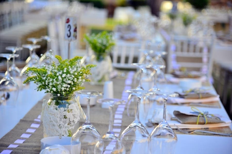 A table set up for a wedding reception, where women returners can network and discuss work-life balance while working towards achieving their desired work arrangements.