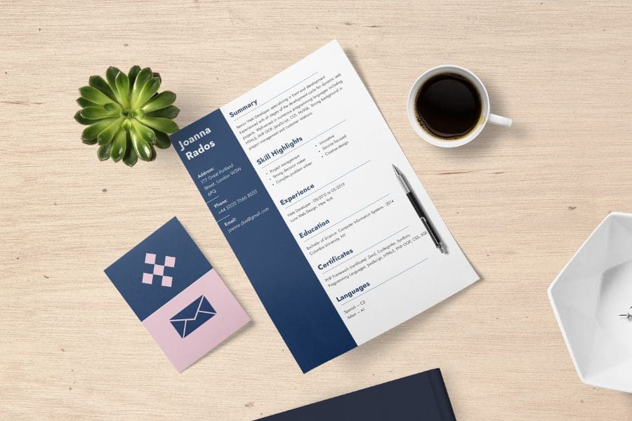 Resume and business cards on table.